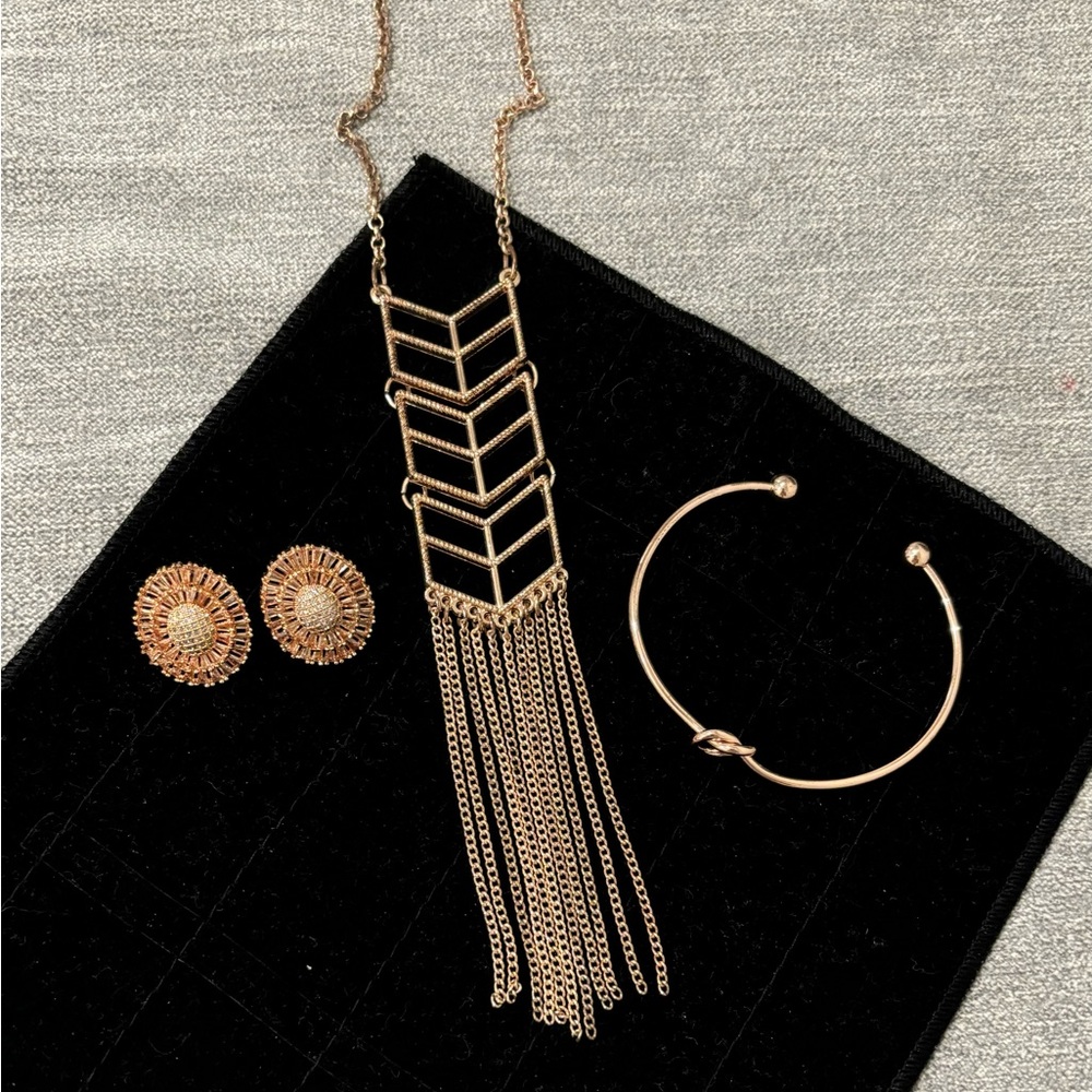 Rose gold-colored jewelry lot: earrings, necklace, bracelet